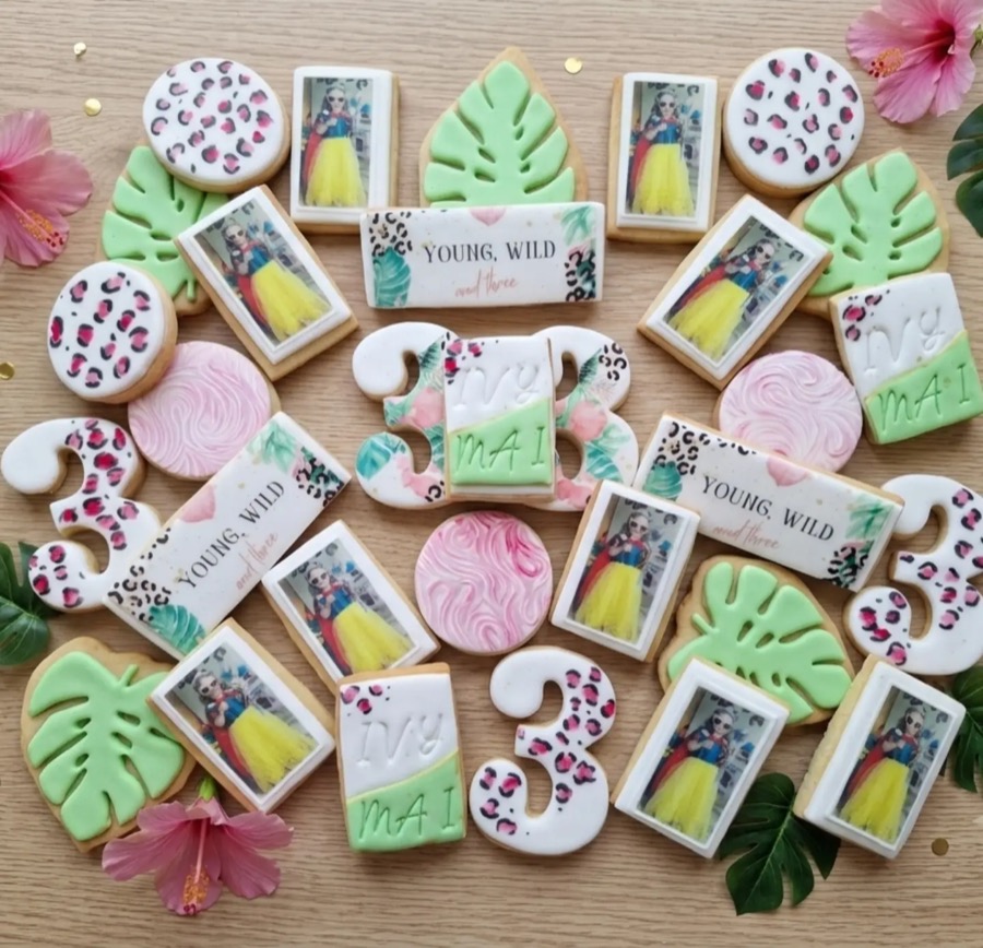 Decorated biscuits laid out on a table