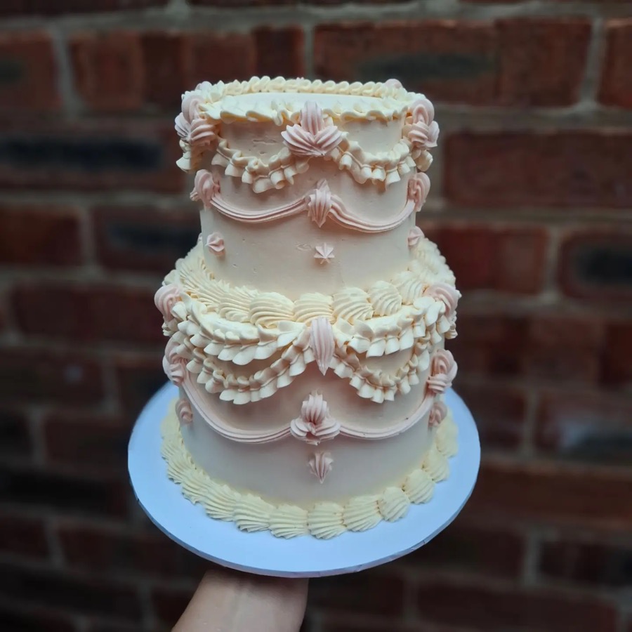 White vintage-style cake with piped frills