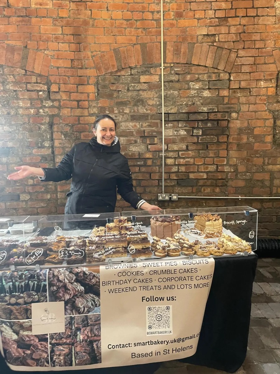 Mira behind the Smart Bakery market stall